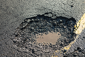 What is a road hazards for your tyres? Learn about hazards. Image of a hazard.